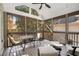 Inviting screened porch features a ceiling fan and comfortable seating area at 5 Renfroe Ct, Decatur, GA 30030