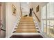 Inviting foyer with a carpeted staircase leading to the upper level and a view from the upper landing at 5 Renfroe Ct, Decatur, GA 30030