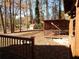 Landscaped backyard with a covered deck and mature trees providing shade and privacy at 727 Regina Ct, Lawrenceville, GA 30043