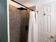 Bathroom with a shower with a door and tile shower walls at 727 Regina Ct, Lawrenceville, GA 30043