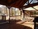 Spacious covered deck offers outdoor living space and a view of the wooded surroundings at 727 Regina Ct, Lawrenceville, GA 30043