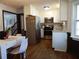 Modern kitchen with stainless steel appliances, white cabinets, and wood-look flooring at 727 Regina Ct, Lawrenceville, GA 30043