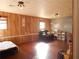 Large living room with wood paneling, a comfortable recliner, and natural light at 727 Regina Ct, Lawrenceville, GA 30043