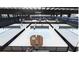 An indoor pickleball court facility with multiple playing fields and viewing area at 114 Iveybrooke Ln # 62, Alpharetta, GA 30009