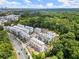 Aerial view of community with mature trees, a city view and modern architecture at 1765 Beckham Ne Pl # 53, Atlanta, GA 30324