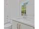 Bathroom features a modern vanity, sink, and faucet, complemented by tiled shower and flooring at 1765 Beckham Ne Pl # 53, Atlanta, GA 30324