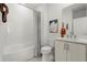 Bathroom featuring tub, tiled shower, and modern vanity at 1765 Beckham Ne Pl # 53, Atlanta, GA 30324