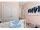 Well-decorated Bedroom featuring a white crib and closet at 1765 Beckham Ne Pl # 53, Atlanta, GA 30324