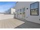Spacious deck with gray wood and access to the house via french doors, perfect for outdoor entertaining at 1765 Beckham Ne Pl # 53, Atlanta, GA 30324
