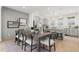 Open-concept dining area with a modern kitchen, stylish lighting, and an inviting dining table at 1765 Beckham Ne Pl # 53, Atlanta, GA 30324
