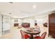 Large finished basement area with a game table and seating with bonus room at 1894 Whitehawk Ct, Lawrenceville, GA 30043