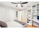 Bedroom with built-in shelves and ceiling fan at 1894 Whitehawk Ct, Lawrenceville, GA 30043