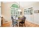 Bright breakfast nook with hardwood floors, large windows, and cozy atmosphere at 1894 Whitehawk Ct, Lawrenceville, GA 30043