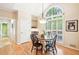 Charming dining area with hardwood floors, large windows, and stylish light fixture at 1894 Whitehawk Ct, Lawrenceville, GA 30043