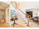 Elegant entryway features staircase with hardwood railings and plush carpeting at 1894 Whitehawk Ct, Lawrenceville, GA 30043