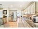 Well-equipped kitchen featuring stainless steel appliances, granite countertops and warm wood flooring at 1894 Whitehawk Ct, Lawrenceville, GA 30043