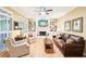 Comfortable living room featuring a fireplace, built-in shelving, and hardwood floors at 1894 Whitehawk Ct, Lawrenceville, GA 30043
