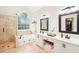 Luxurious main bathroom with double vanity, soaking tub, and separate glass shower at 1894 Whitehawk Ct, Lawrenceville, GA 30043
