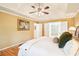 Comfortable main bedroom features a tray ceiling, hardwood floors, and ensuite bathroom at 1894 Whitehawk Ct, Lawrenceville, GA 30043
