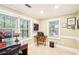 Basement office space with dual windows and built in desk with storage at 1894 Whitehawk Ct, Lawrenceville, GA 30043