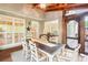 Spacious screened porch offering ample seating, dining area, wood ceilings, and outdoor living at 1894 Whitehawk Ct, Lawrenceville, GA 30043
