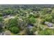 An aerial view of the property in a neighborhood filled with mature trees providing shade and a sense of privacy at 2301 Sharon Se Ct, Conyers, GA 30013