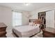 A bedroom features a cozy bed, ample closet space, and soft lighting for a peaceful atmosphere at 2301 Sharon Se Ct, Conyers, GA 30013