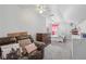 Bedroom with a couch, a bed and dresser, and an overhead fan creating a comfortable atmosphere at 2301 Sharon Se Ct, Conyers, GA 30013
