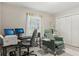 A bedroom transformed into a versatile space, featuring a workspace and a comfortable chair at 2301 Sharon Se Ct, Conyers, GA 30013