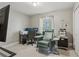 A bedroom transformed into a versatile space, featuring a workspace and a comfortable chair at 2301 Sharon Se Ct, Conyers, GA 30013