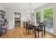 Lovely dining room with hardwood floors, large windows and a view to outside, and a view to the pantry at 2301 Sharon Se Ct, Conyers, GA 30013