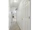 Hallway view with carpeted floors leading to a bathroom with a view to the living room at 2301 Sharon Se Ct, Conyers, GA 30013