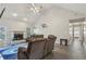 Comfortable living room with vaulted ceilings, modern lighting, a fireplace, and a walkout to outside at 2301 Sharon Se Ct, Conyers, GA 30013