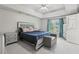 Bright main bedroom features tray ceilings, neutral walls, recessed lighting, and a private ensuite bathroom at 2301 Sharon Se Ct, Conyers, GA 30013