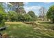 This expansive backyard has mature trees and provides plenty of space for outdoor activities at 2301 Sharon Se Ct, Conyers, GA 30013