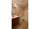 Standard bathroom featuring a shower-tub combo, toilet, and vanity sink with dark wood cabinetry at 2896 Vining Ridge Ter, Decatur, GA 30034