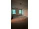 Spacious bedroom with two windows providing natural light; needing carpet cleaning at 2896 Vining Ridge Ter, Decatur, GA 30034