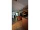 Kitchen featuring wood cabinets, an island with granite countertops, and modern appliances at 2896 Vining Ridge Ter, Decatur, GA 30034