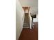 Carpeted stairs leading to the second floor, with a view of the hardwood living space at 2896 Vining Ridge Ter, Decatur, GA 30034