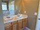 This bathroom features a double sink vanity with a large mirror and traditional lighting at 4234 Winston Cir, Atlanta, GA 30349