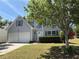 Charming home with a two-car garage, well-manicured lawn, mature landscaping, and traditional curb appeal at 4234 Winston Cir, Atlanta, GA 30349