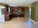 Spacious kitchen featuring tiled floors, ample cabinet space, and modern appliances at 4234 Winston Cir, Atlanta, GA 30349