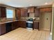 Well-equipped kitchen featuring tiled floors, plenty of cabinet space, and modern appliances at 4234 Winston Cir, Atlanta, GA 30349