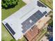 Aerial view of home's roof with solar panels, a wooden deck and outdoor seating area at 724 Camelot Way, Norcross, GA 30071