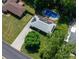 Overhead view of home with solar panels, an in-ground pool and lush landscaping in a quiet neighborhood at 724 Camelot Way, Norcross, GA 30071