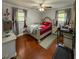 Bedroom including a treadmill, hardwood floors, and a decorative bed at 724 Camelot Way, Norcross, GA 30071
