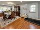 Bright dining room with hardwood floors, a dining table, and a decorative hutch at 724 Camelot Way, Norcross, GA 30071