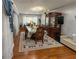 Cozy dining room featuring hardwood floors, a decorative rug, and elegant wooden furniture at 724 Camelot Way, Norcross, GA 30071