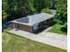 Aerial view of a well-maintained single-Gathering home with solar panels and an inviting backyard pool at 724 Camelot Way, Norcross, GA 30071