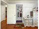Hallway leading to bathroom; includes a glimpse of the decor and tiled floor at 724 Camelot Way, Norcross, GA 30071